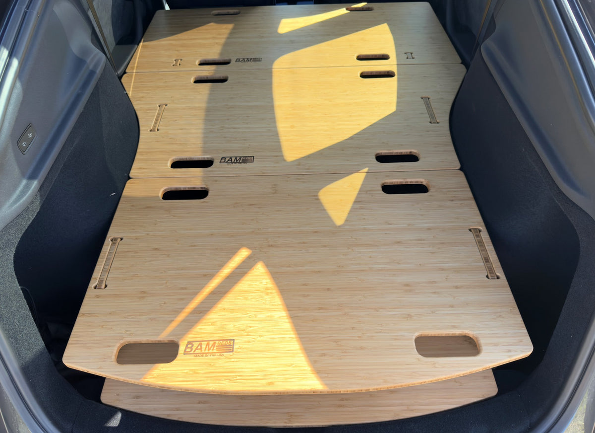 BamBeds branding on bamboo leveling platform in Tesla Model Y