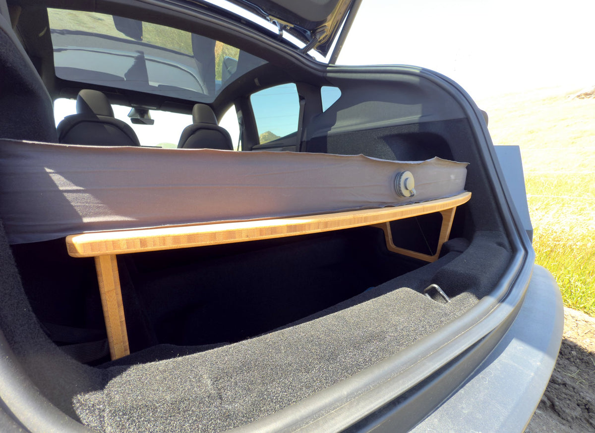 Mattress on BamBeds bamboo leveling platform in Tesla Model Y with storage underneath