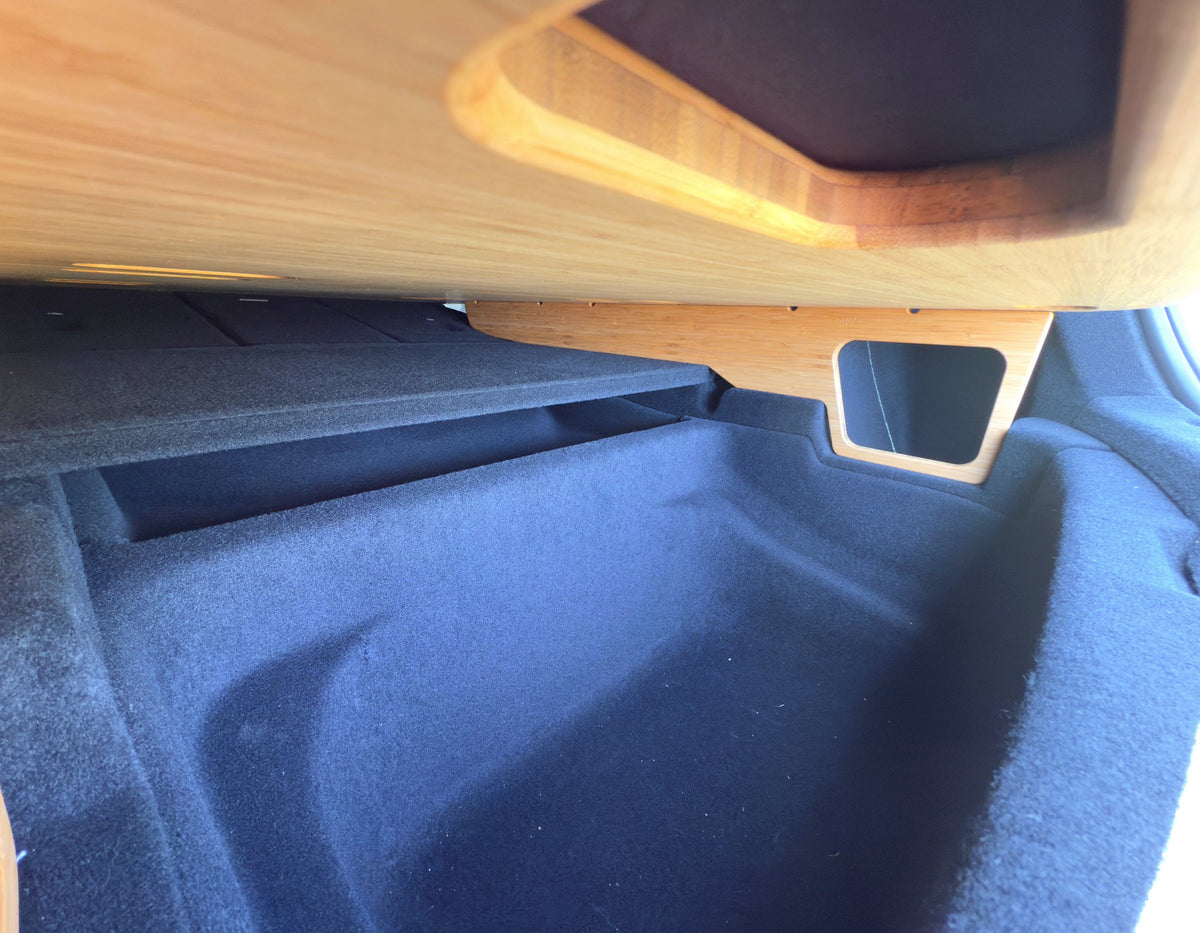 Under-storage well beneath BamBeds bamboo platform in Tesla Model Y